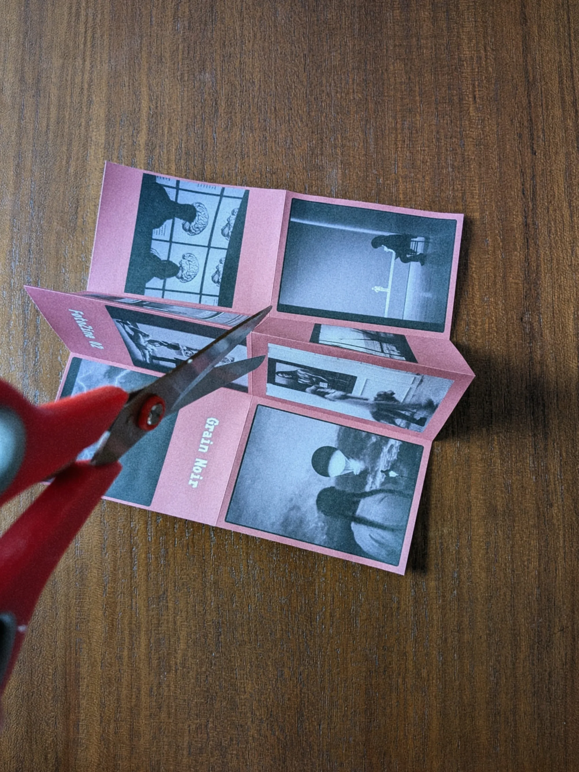 Scissors cutting along the center fold