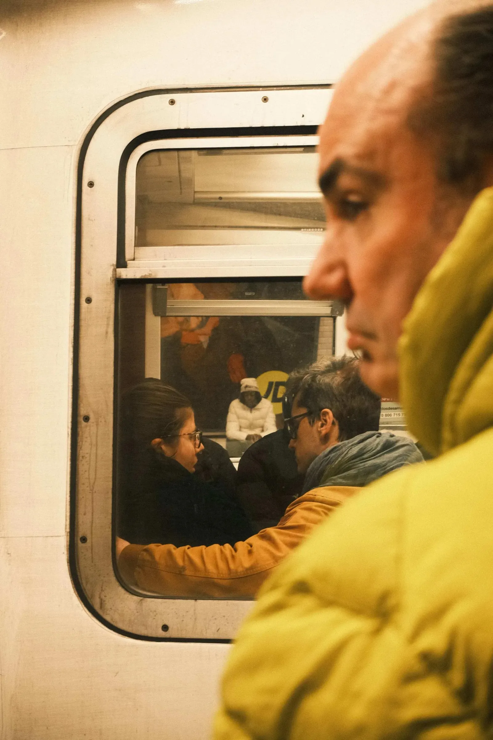 Multiple layers on this shot of strangers in Paris, street photography.